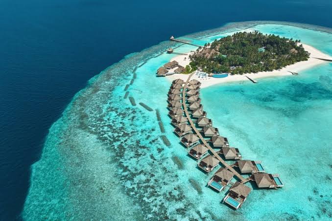 Maldives overwater villas turquoise lagoon