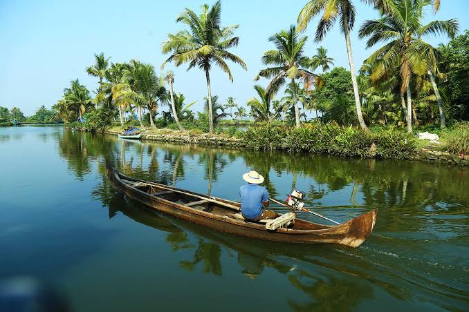 Kerala houseboat gliding through backwaters