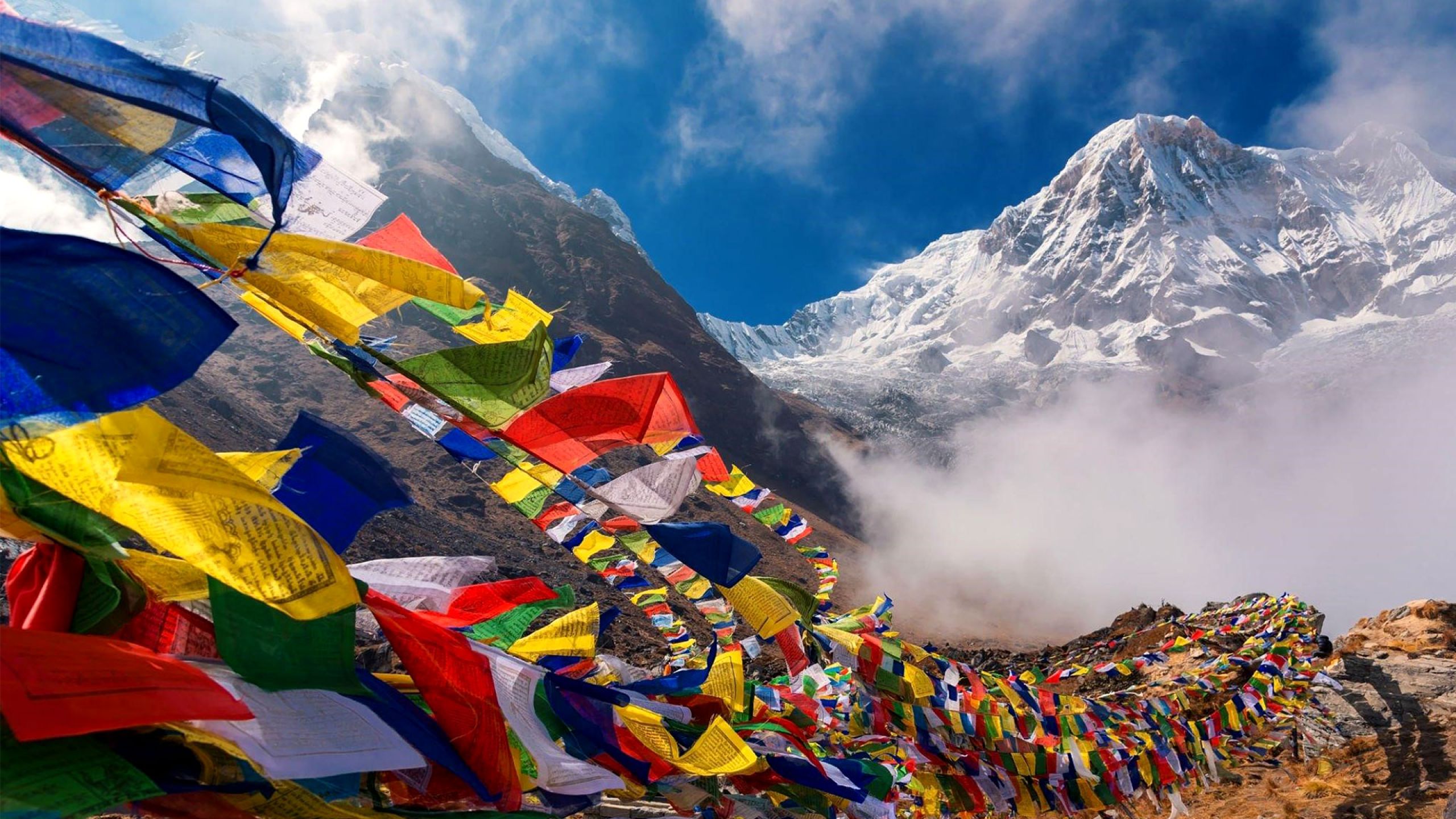 Snow-capped Himalayan peaks with prayer flags